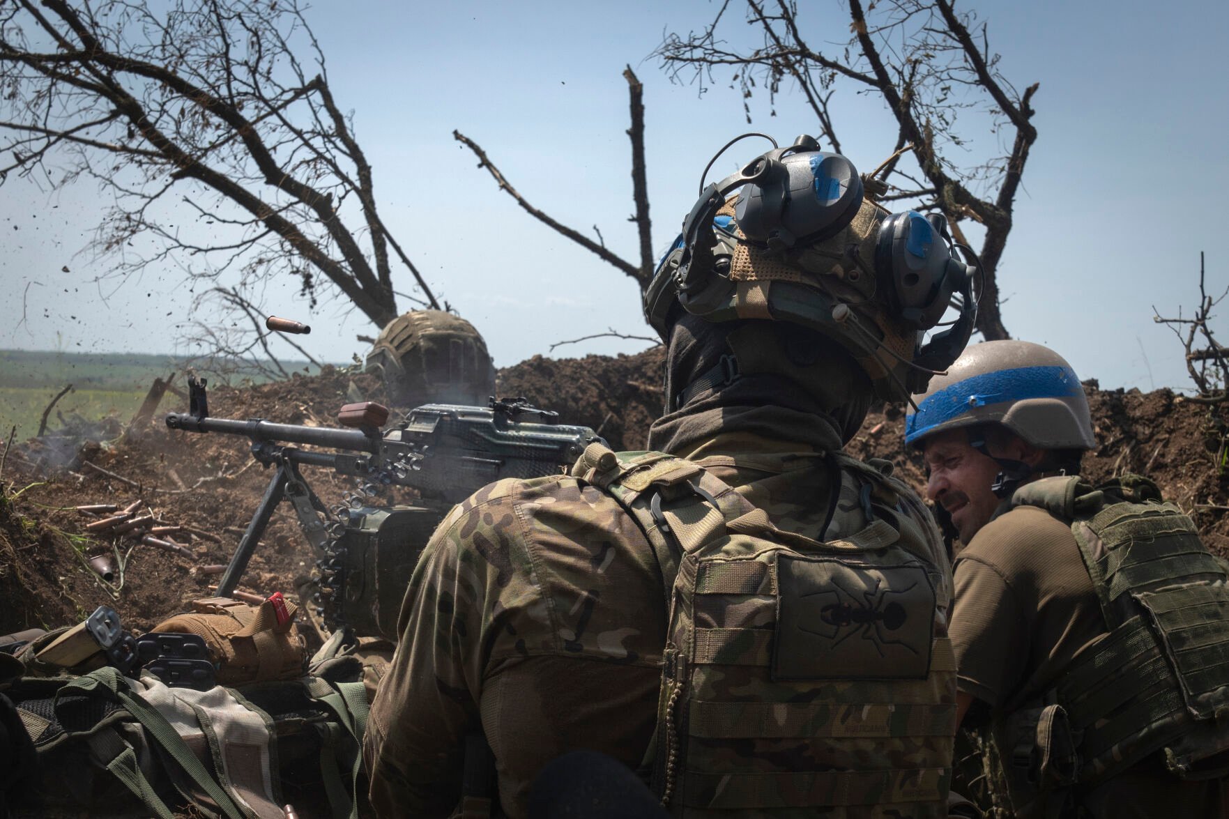 <p>Ukrainian soldiers fire at Russian forces June 23 from a trench on the frontline in Zaporizhzhia region, Ukraine.</p>