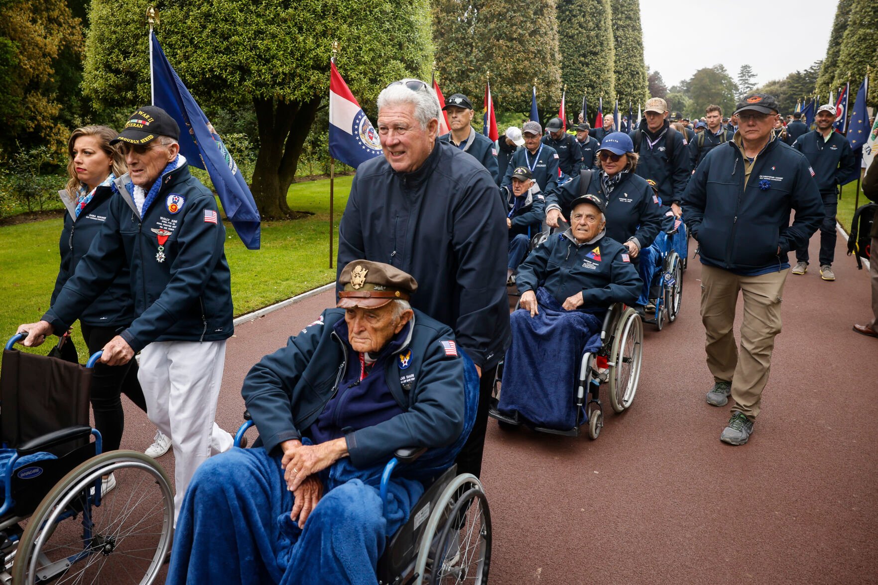 <p>U.S. war veterans arrive for a ceremony Tuesday at the American Cemetery in Colleville-sur-Mer, Normandy, France, to mark the 79th anniversary of D-Day.</p>