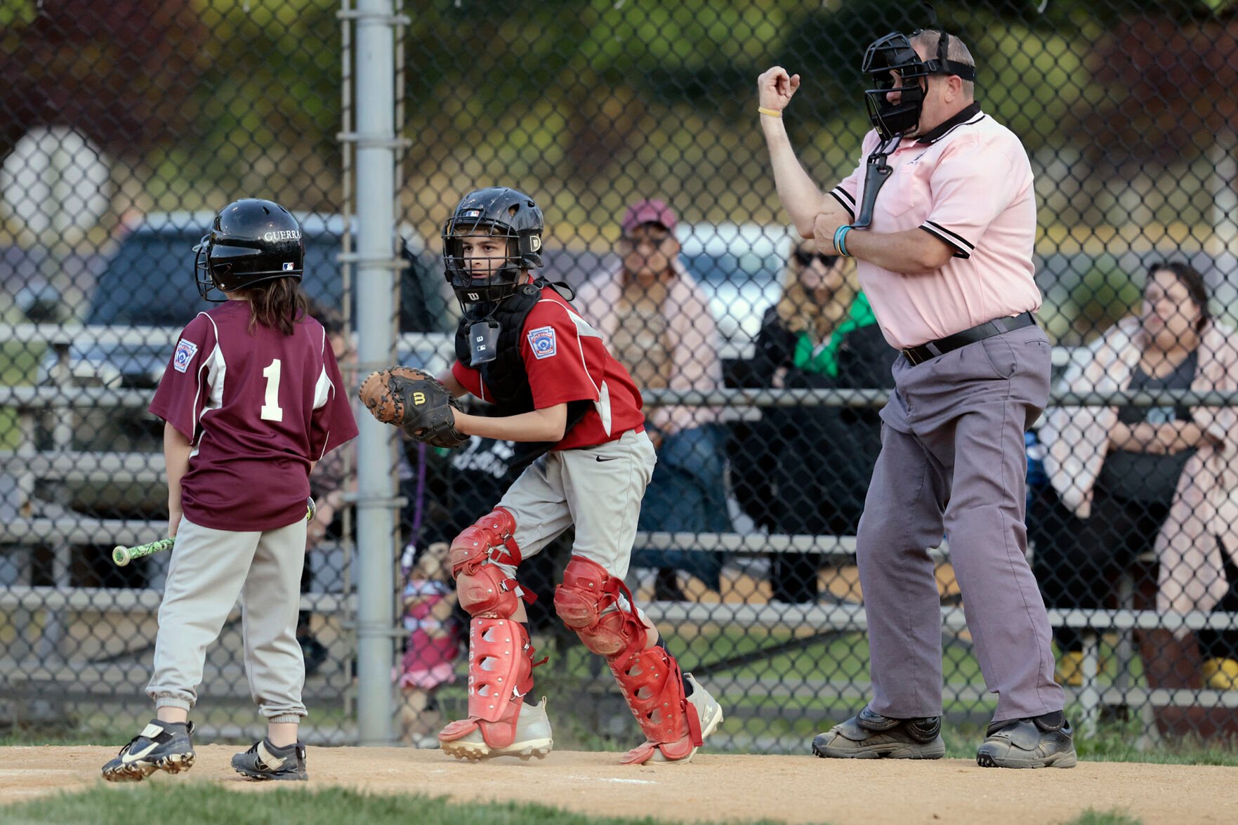 <p>Umpire Brian Kennedy makes a call while officiating a game at the Deptford Little League complex in Deptford, N.J., on May 10.</p>
