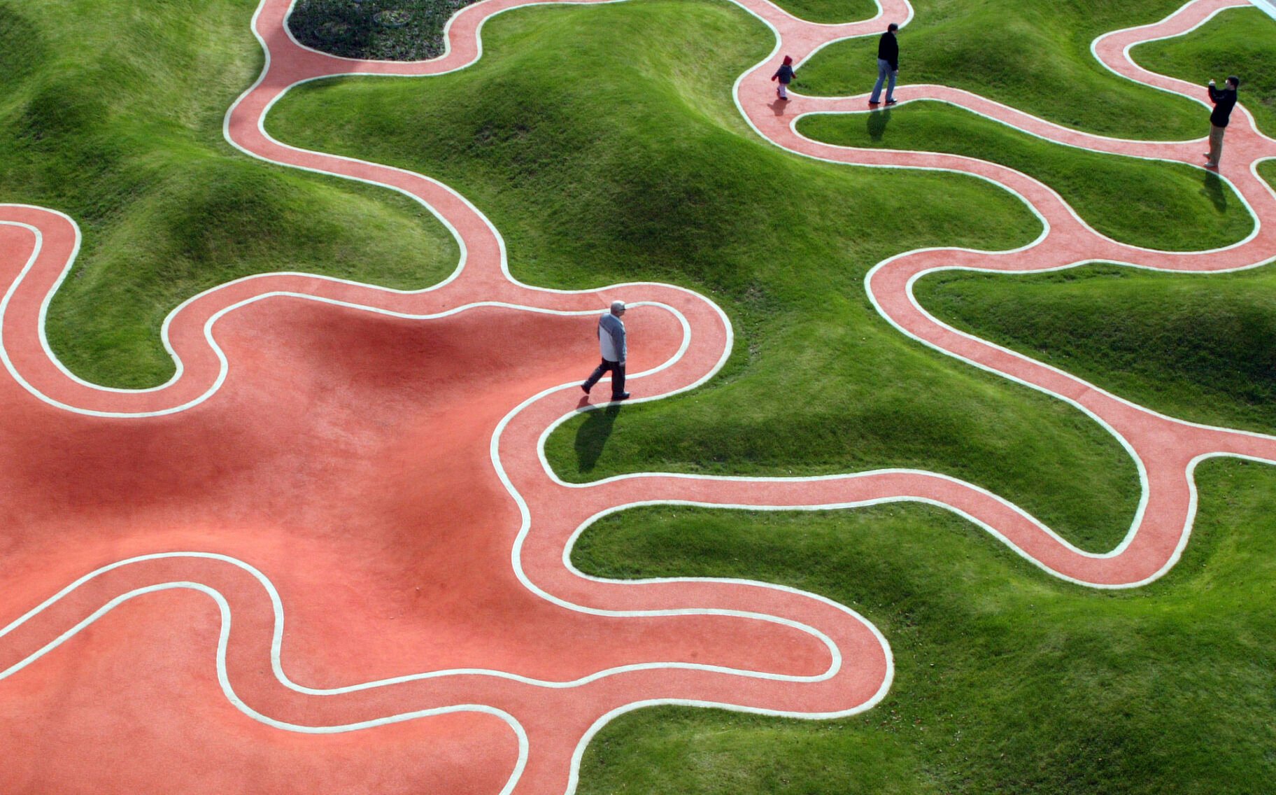<p>Visitors walk through a garden installation designed like the bottom-side of a leaf, on the opening day of the National Garden Festival "BUGA 05" in Munich, southern Germany, on April 28, 2005. </p>