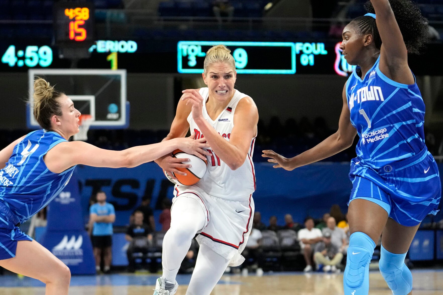 <p>Washington Mystics' Elena Delle Donne drives between two Chicago Sky defenders during a June 22 game in Chicago.</p>