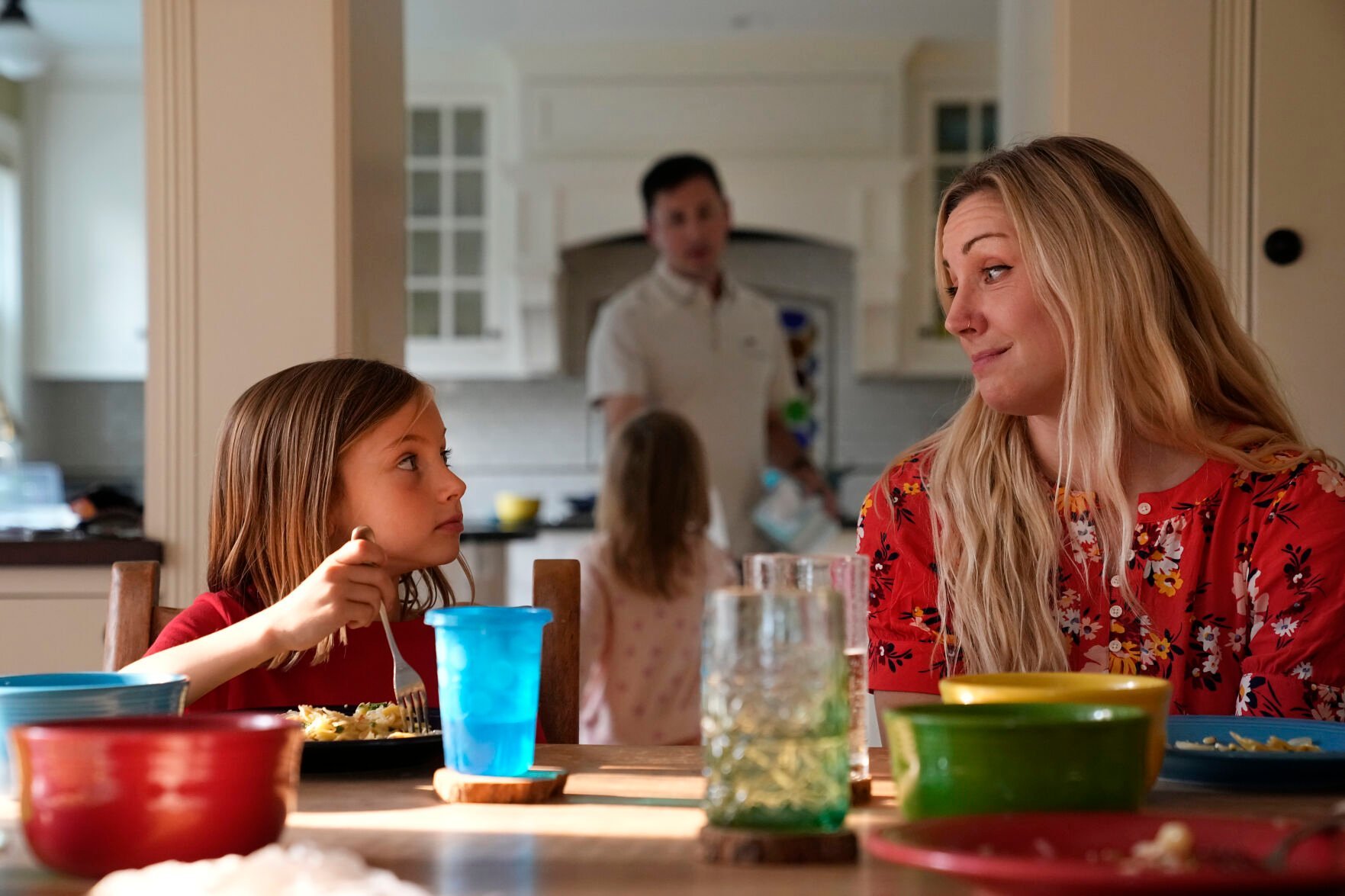 <p>OB-GYN Dr. Kylie Cooper sits at the dinner table with her daughter, Hazel, on June 15 in Minnesota.</p>