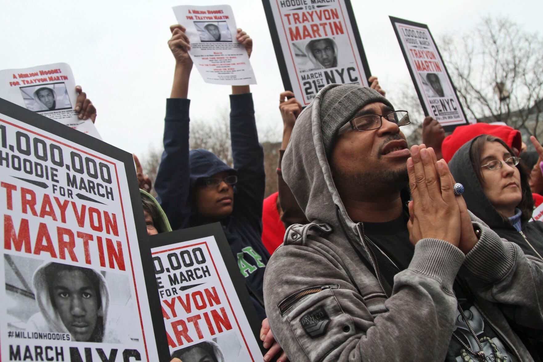 <p>FILE - Demonstrators pray during the Million Hoodie March for Trayvon Martin in Union Square, March 21, 2012, in New York. The Black Lives Matter movement hits a milestone on Thursday, July 13, 2023, marking 10 years since its 2013 founding in response to the acquittal of the man who fatally shot Martin. Gunned down in a Florida gated community where his father lived in 2012, Martin was one of the earliest symbols of a movement that now wields influence in politics, law enforcement and broader conversations about racial progress. (AP Photo/Mary Altaffer, File)</p>
