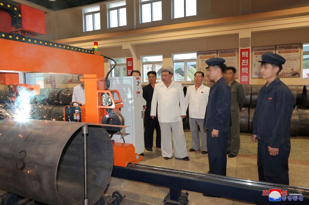 New Photos Show North Korea’s Kim Touring Arms Factories, And Taking Aim