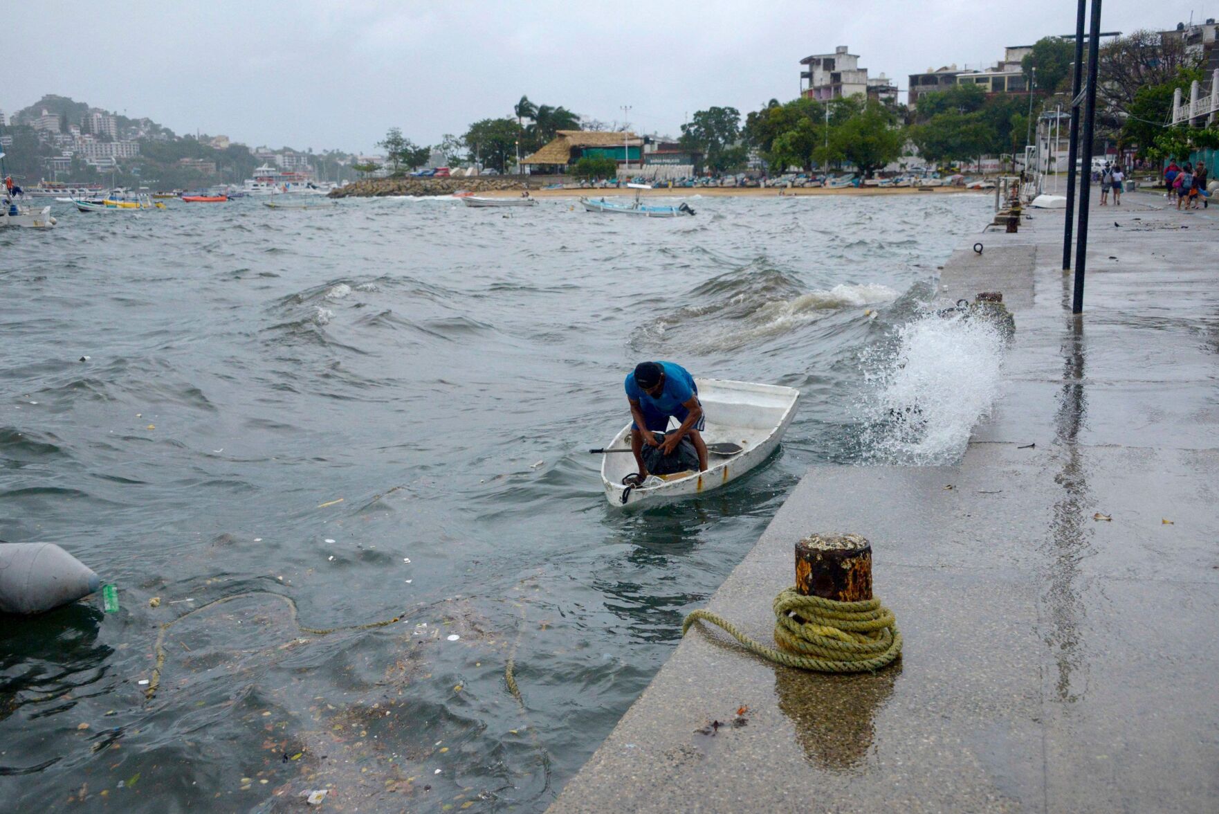 <p>A man moors his boat in Acapulco, Guerrero State, Mexico, as then-tropical storm Hilary churns in the Pacific Ocean on Wednesday. <span>Hurricane Hilary has grown rapidly to Category 4 strength and could reach Southern California as the first tropical storm there in 84 years. </span></p>