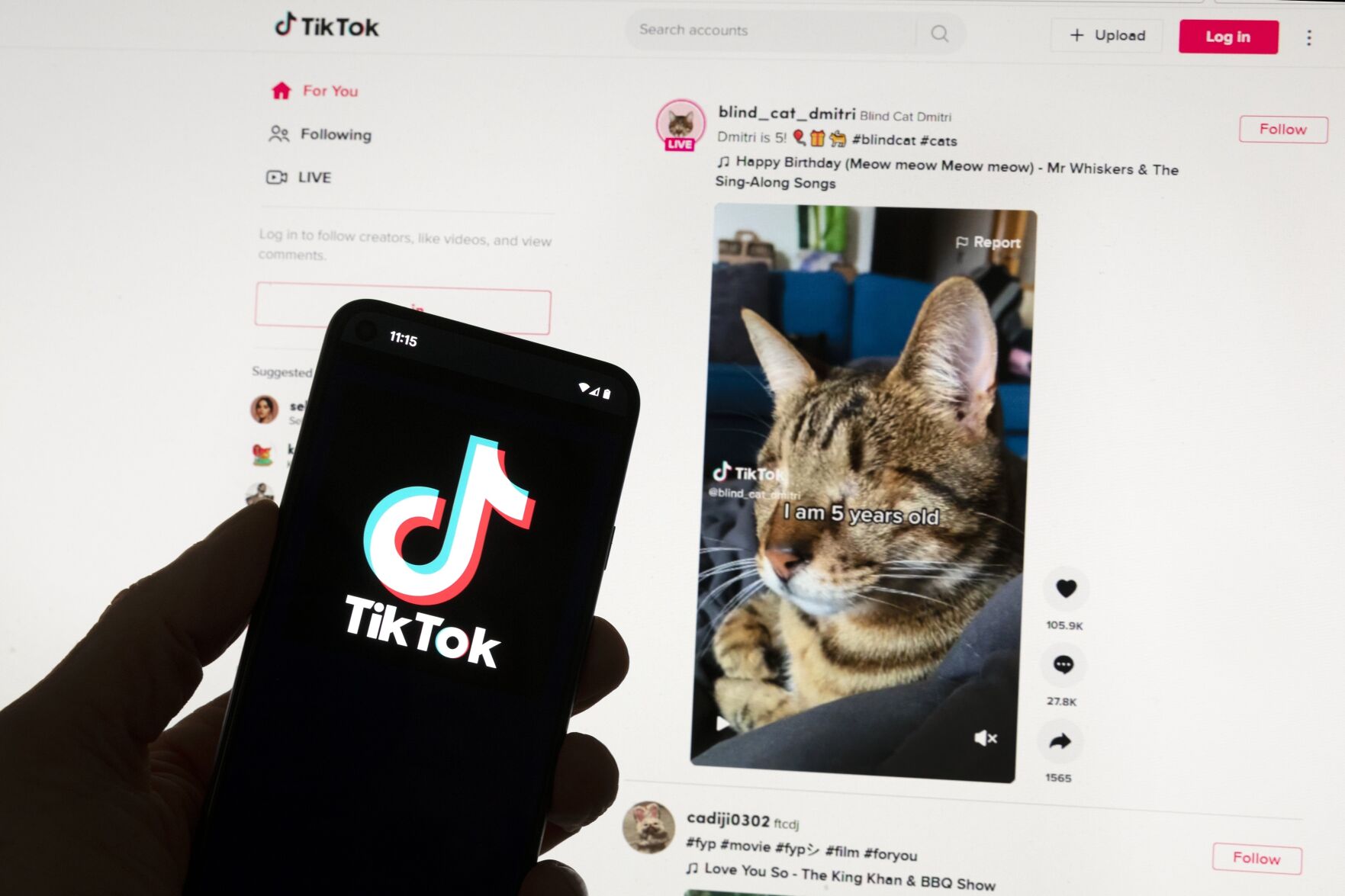 <p>The TikTok logo is seen on a mobile phone in front of a computer screen which displays the TikTok home screen, Saturday, March 18, 2023, in Boston. Google, Facebook, TikTok and other Big Tech companies operating in Europe are facing one of the most far-reaching efforts to clean up what people encounter online. (AP Photo/Michael Dwyer)</p>