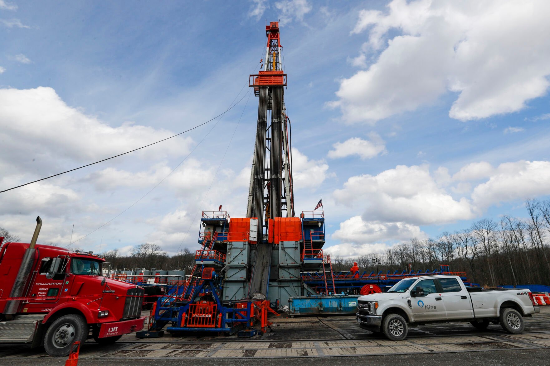 <p>FILE - Work continues at a shale gas well drilling site in St. Mary's, Pa., March 12, 2020. </p>