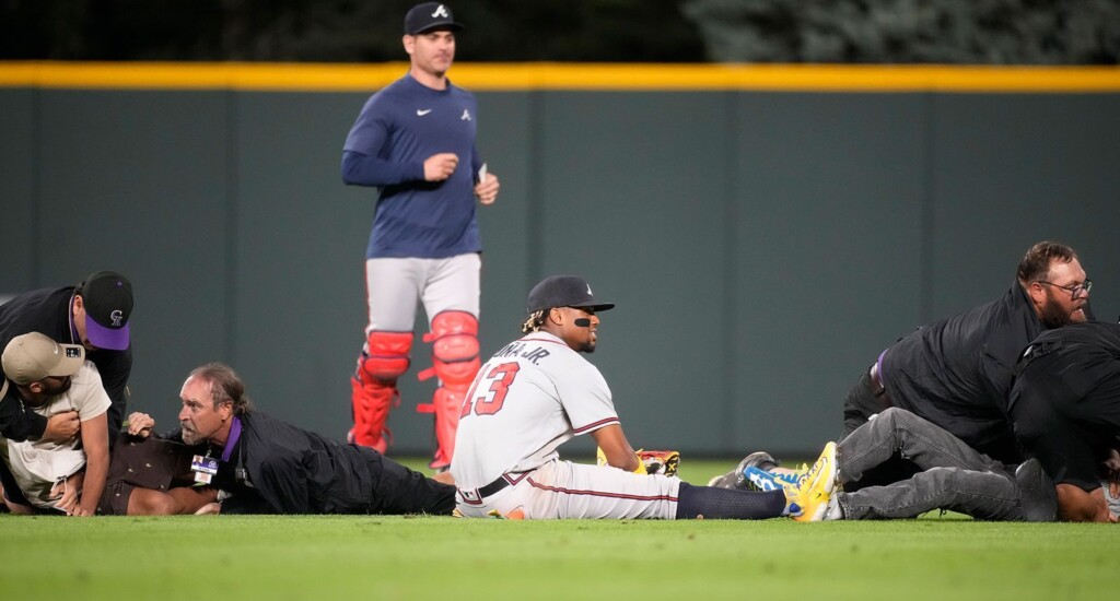 Atlanta Braves’ Ronald Acuña Jr. Knocked To The Ground After Two Fans Run Onto Coors Field