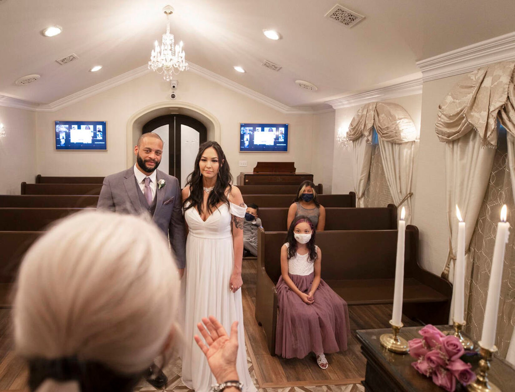 <p>William and Brandi Alexander of Anchorage, Alaska, renew their vows at a ceremony attended by friends and family around the country via Zoom on Sept. 23, 2020, at Chapel of the Flowers in Las Vegas.</p>