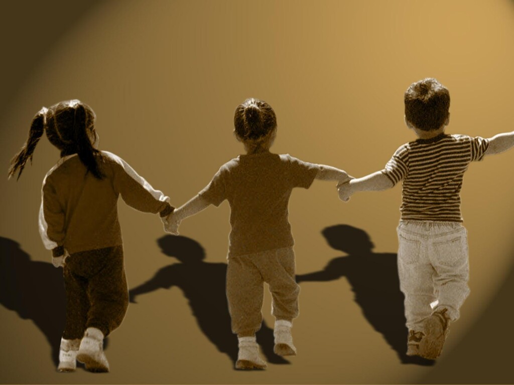 Group Of Children Hold Hands In Line On Texture