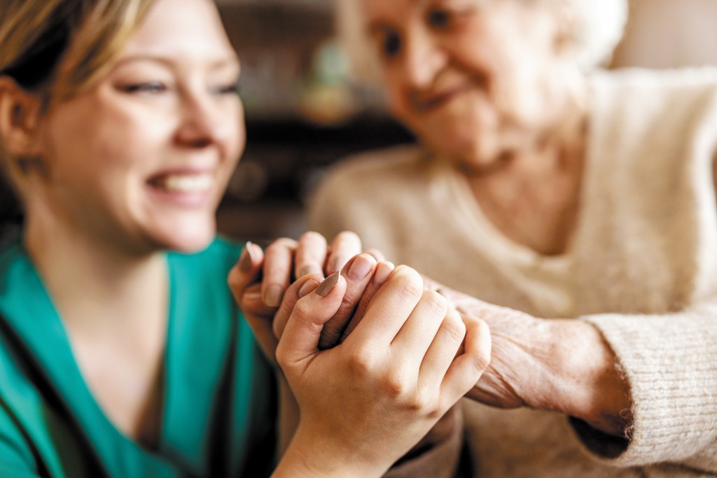 Cropped Shot Of A Senior Woman Holding Hands With A Nurse