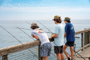Anglers try their luck from the Navarre Beach Fishing Pier. At 1,545 feet, the pier is the longest of its kind in Florida. Photo courtesy of Santa Rosa County Tourist Development Office