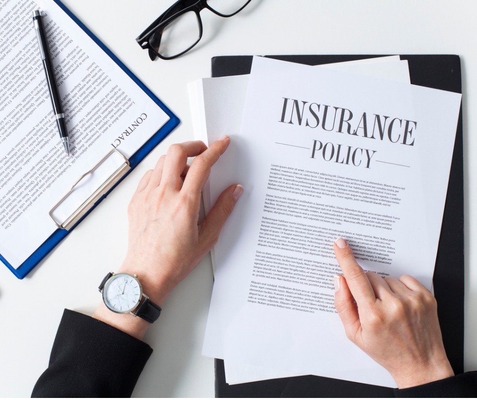 Business Woman Examining Insurance Policy Picture Id1180387704