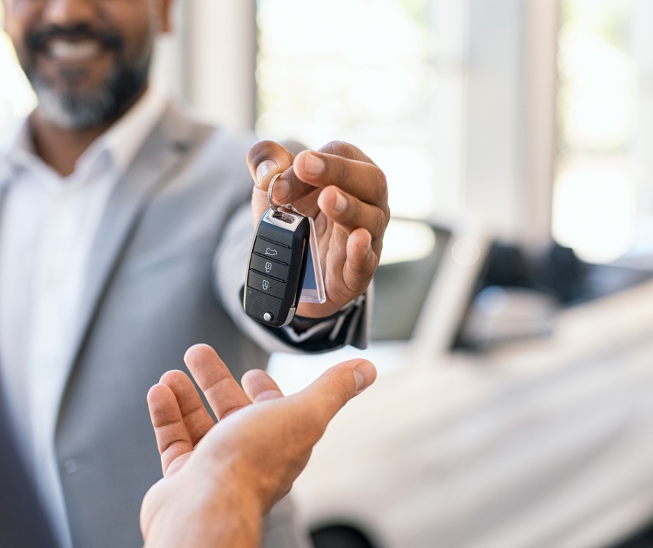 Salesman Giving New Car Keys To Customer Picture Id1138560072