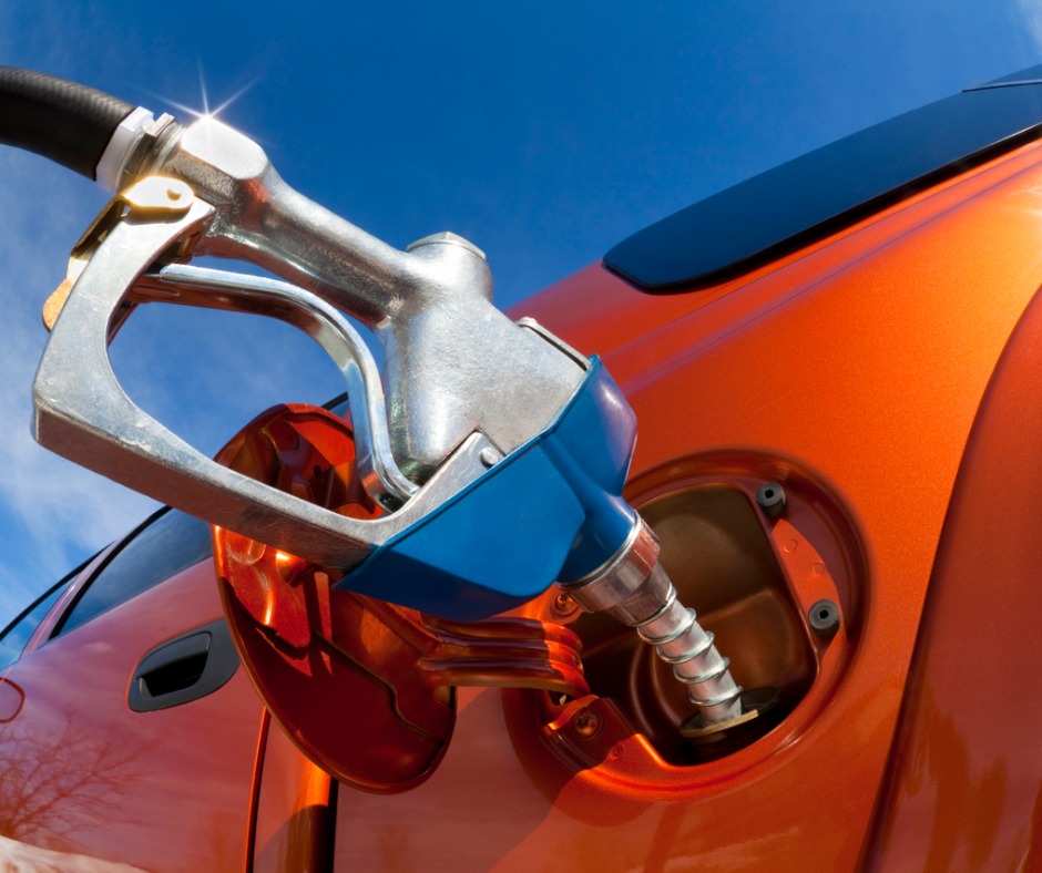 Pumping Gas Into Gasguzzler On A Sunny Day Picture Id155160026