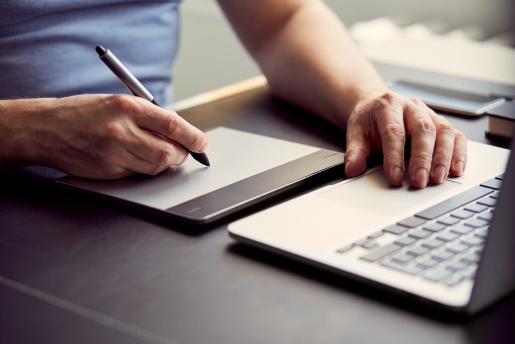 Graphic Designer Working With Graphics Tablet