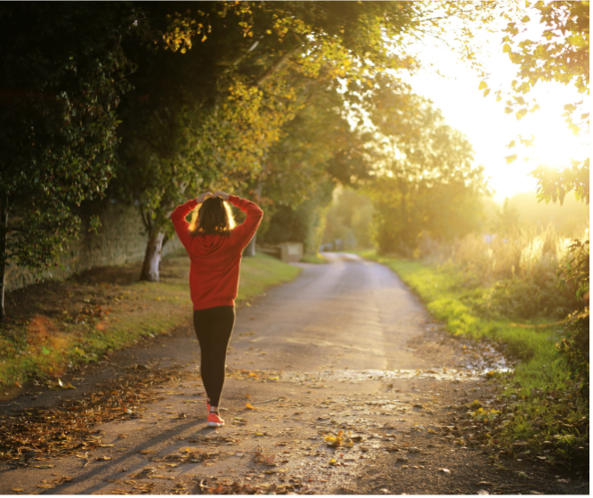 Person walking down dirt road