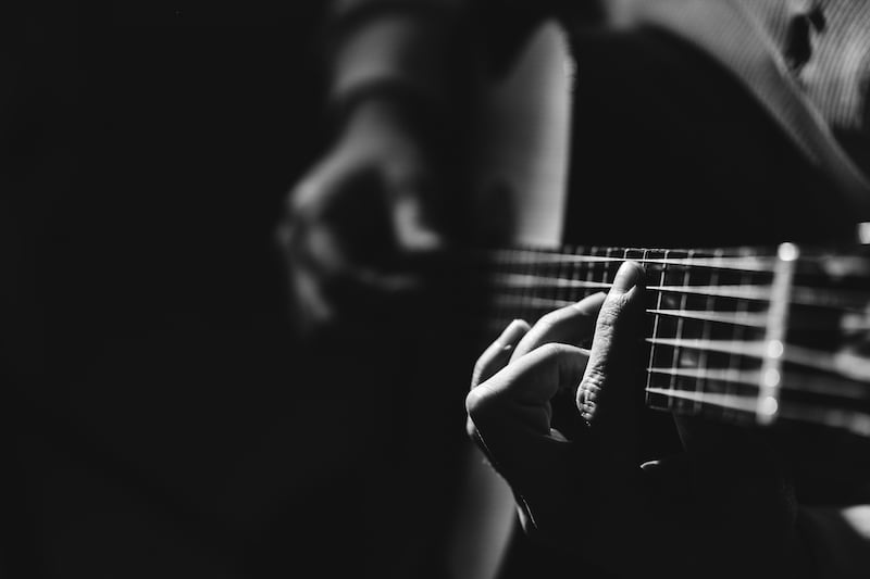 Midsection Of Man Playing A Guitar, Black And White