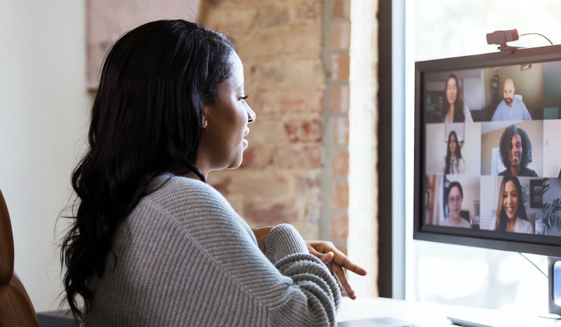Working From Home, Woman Meets With Colleagues Via Video Conference