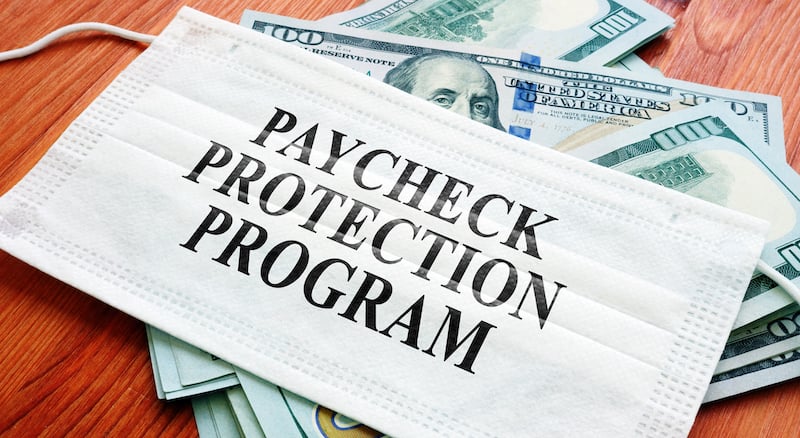 Ppp Paycheck Protection Program As Sba Loan Written On The Mask And Money.