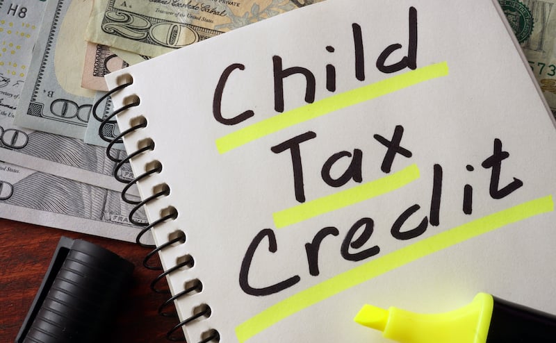 Notebook With Child Tax Credit Sign On A Table.