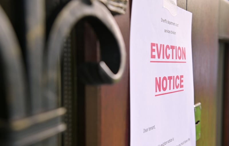 The Notice Of Eviction Of Tenants Hangs On The Door Of The House