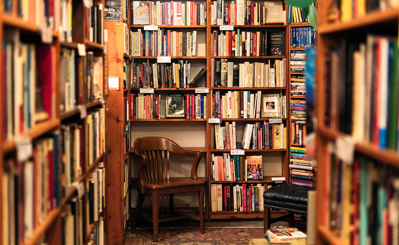 Books On Display In The Corner Of A Second Hand Bookstore