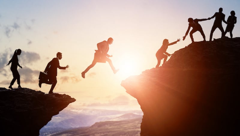 Challenge Of Business Concept. Group Of Businesspeople Climbing A Mountain. Teamwork. Success.