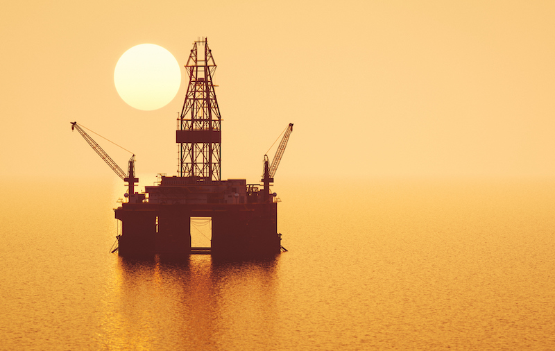 Offshore Oil Rig At Sunset