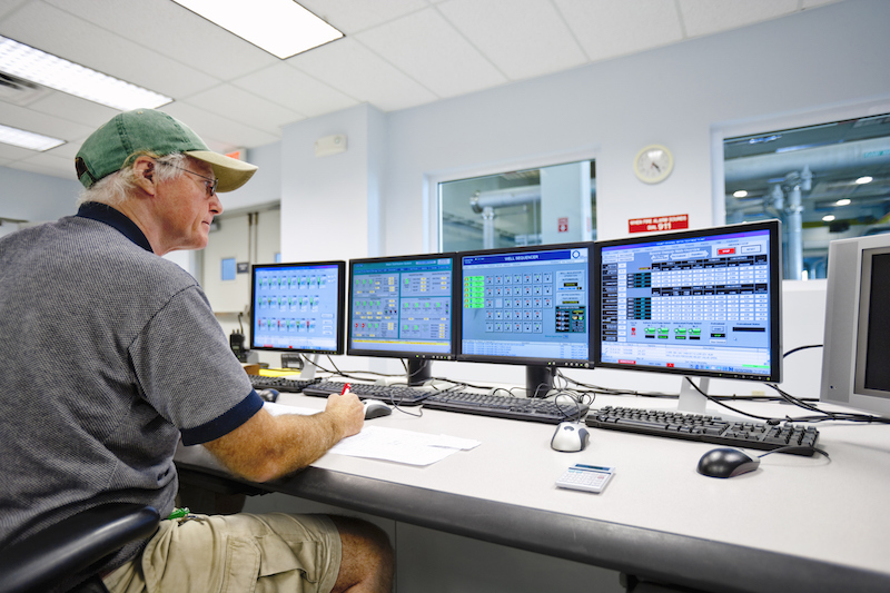 Technician Monitoring In Control Room