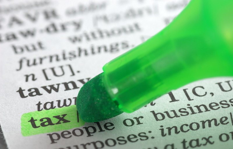 Tax Defintion Highlighted In Dictionary