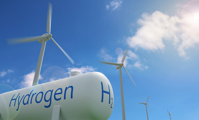 Hydrogen Tank And Windmills On Blue Sky Background. Sustainable And Ecological Energy Concept. 3d Illustration.