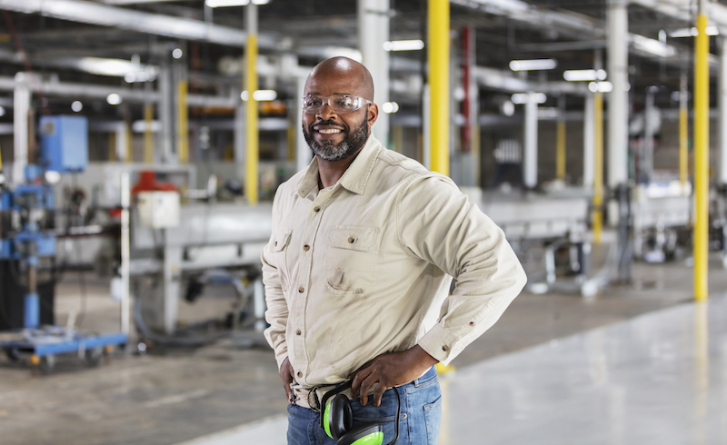 African American Man Working In Plastics Factory