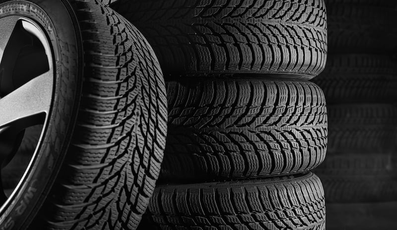 Tires In Car Workshop With Copy Space