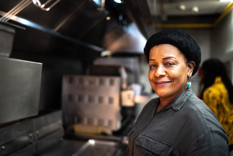 Portrait Of A Mature Woman At A Commercial Kitchen