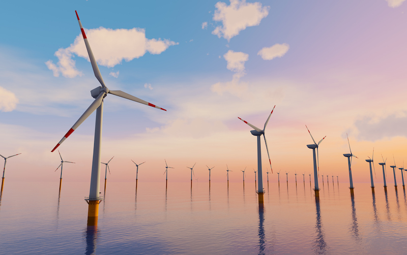 3d Rendering Of Giant Wind Turbines Farm Located In The Open Sea, Sunset Shot. Concept Of Renewal Energy Using Windmills