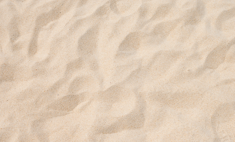 Closeup Of Sand Pattern Of A Beach In The Summer