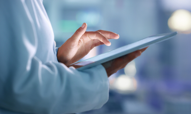 Doctor, Researcher Or Scientist Browsing The Internet On A Tablet For Information While Working At A Lab, Science Facility Or Hospital. Expert, Medical Professional Or Surgeon Searching The Internet