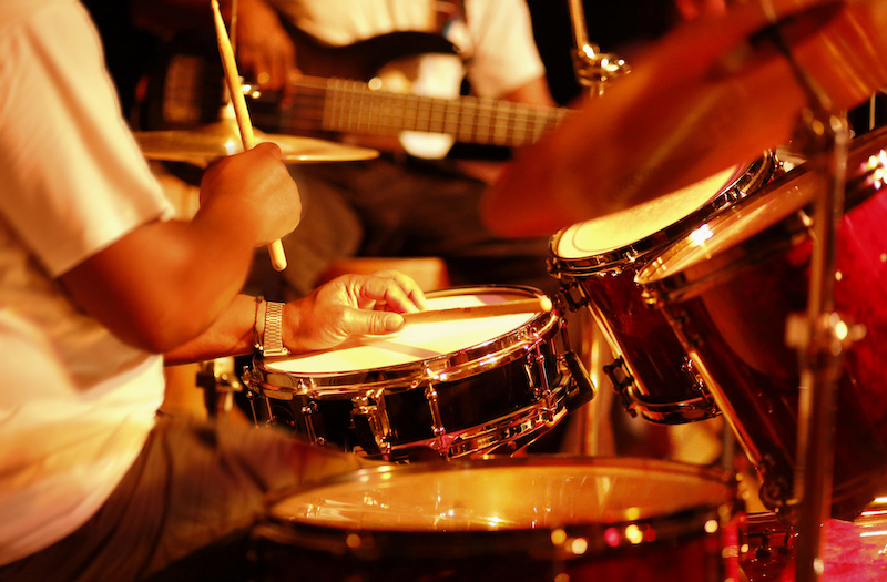 Drummer Playing On Stage