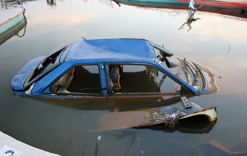 Old Broken Car Submerged In Water