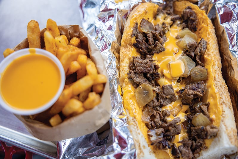 Charlotte, North Carolina August 9th, 2022 : Cheats Cheesesteaks Classic Whiz Wit Cheesesteak Italian Hoagie On A Seeded Liscio's Roll A Taylor Pork Roll, Egg & Cheese Cheese Fries Photographed By Peter Taylor In Charlotte, Nc. August 9, 2022.