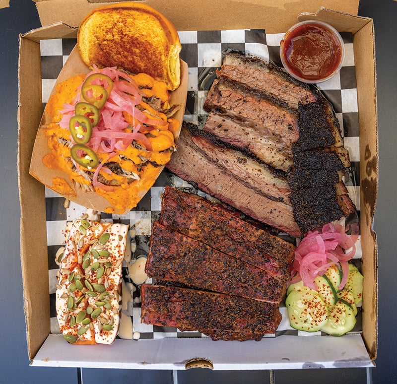 Charlotte Nc, July 5, 2024 Union Barbecue Food Truck Holden Sasser Tray Of Food, Spare Ribs, Brisket, Pork Sandwich, Smokey Sweet Potato Photographed By Peter Taylor In Charlotte, Nc, July 5, 2024