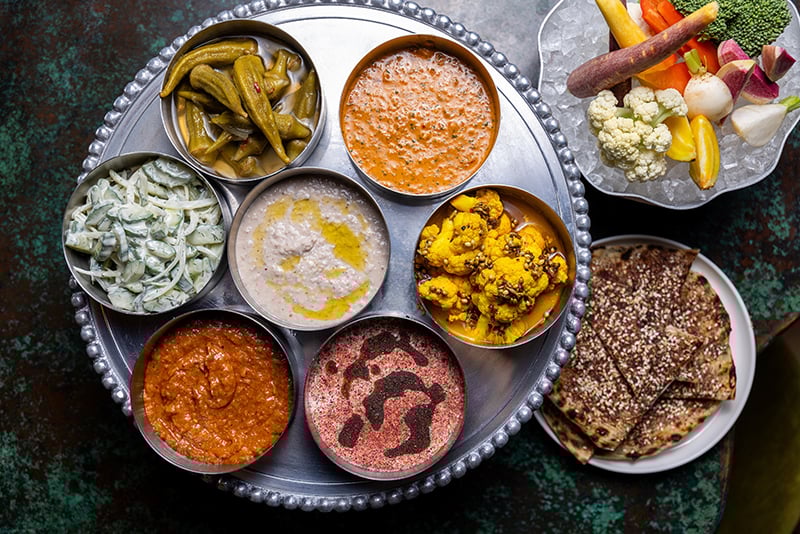 Charlotte Nc, November 01, 2024 Joe And Katy Kindred Albertine Restaurant Crispy Pickle Brined Sc Quail Meze Platter With Red Schug, Whipped Feta, Plus 4 Others (turmeric Pickled Cauliflower, Zaalouk, Sc Conch Pea Hummus And Cucumber Salad) The Smoked G