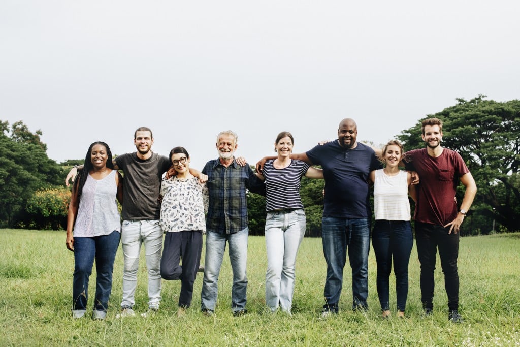 Happy Diverse People Hugging Each Other In The Park