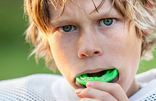 Bigstock Boy Putting In His Mouth Guard 43146865