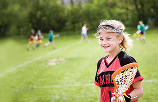 Bigstock Lacrosse Player With The Game 26248580