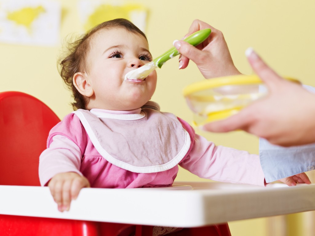 Bigstockphoto Mother Feeding Her Baby 6975458