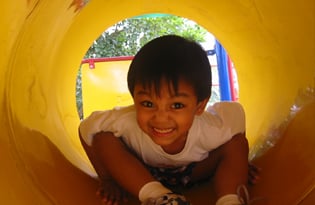 children fighting on playground