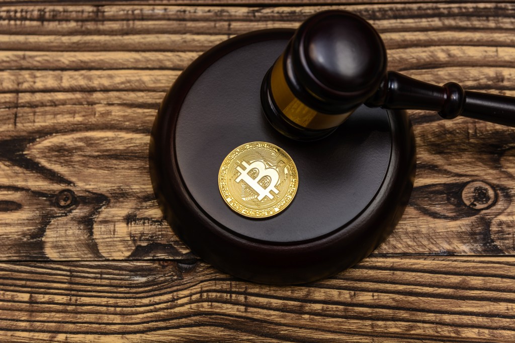 Judge,gavel,on,wooden,background,with,bitcoin