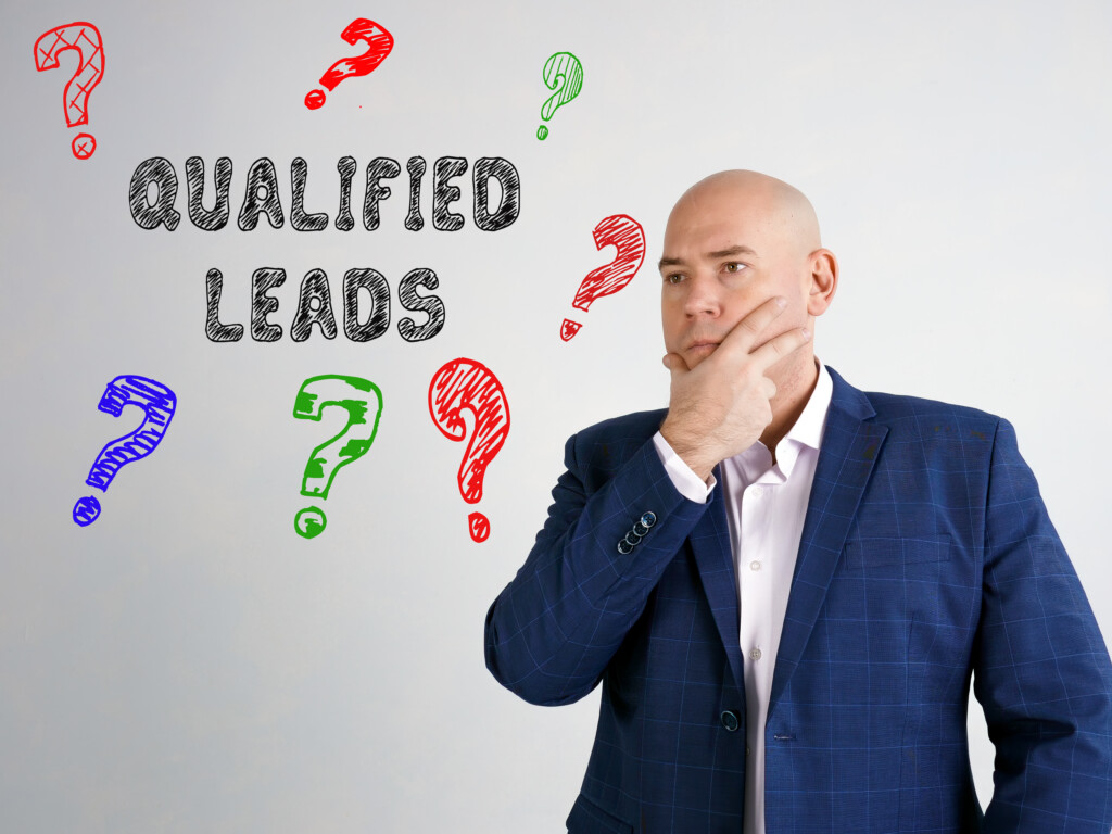How to generate qualified leads: question marks with sign on the side and businessman thinking